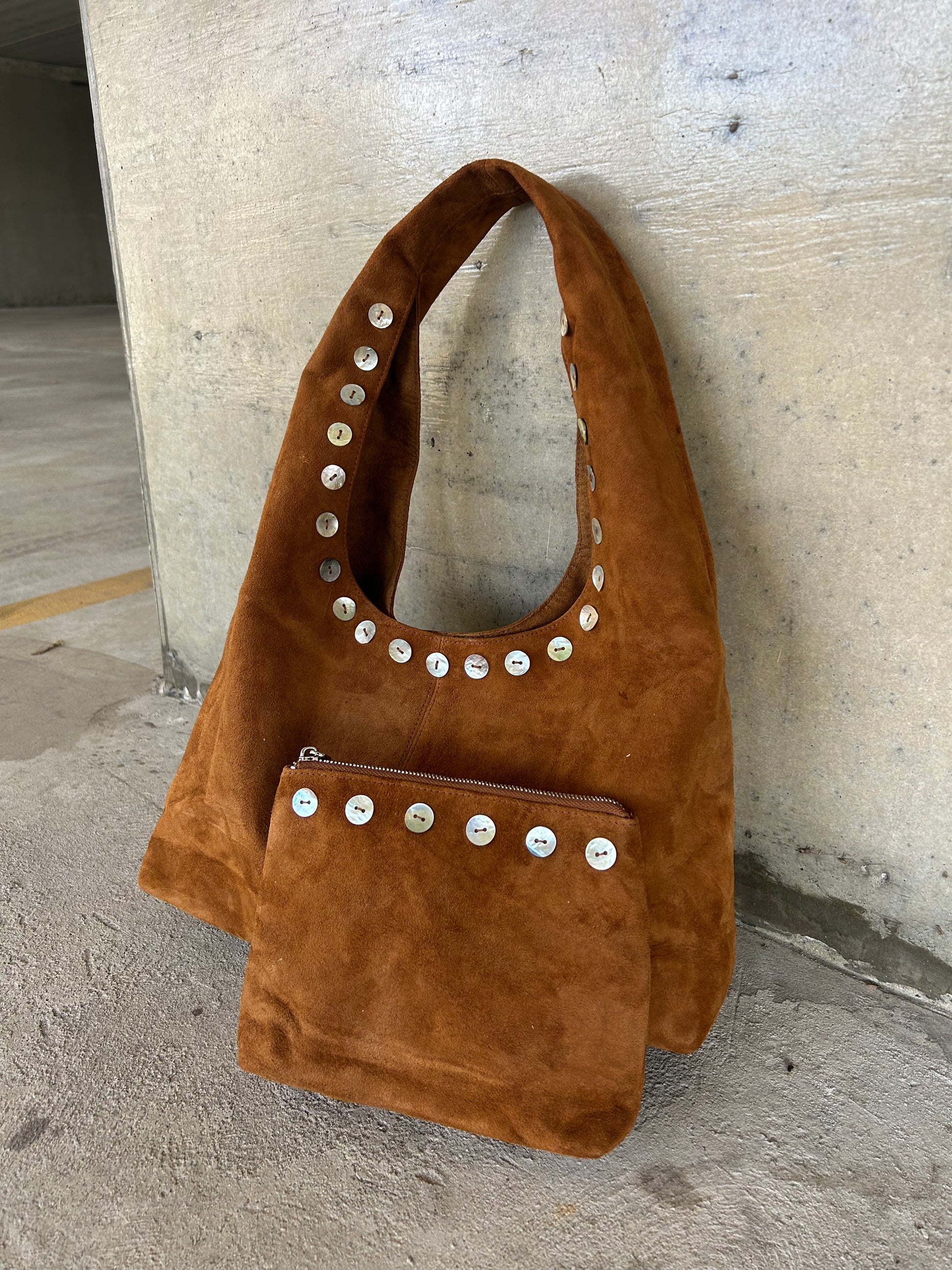 sued slouch shoulder bag matching pouch dae resort pearl buttons